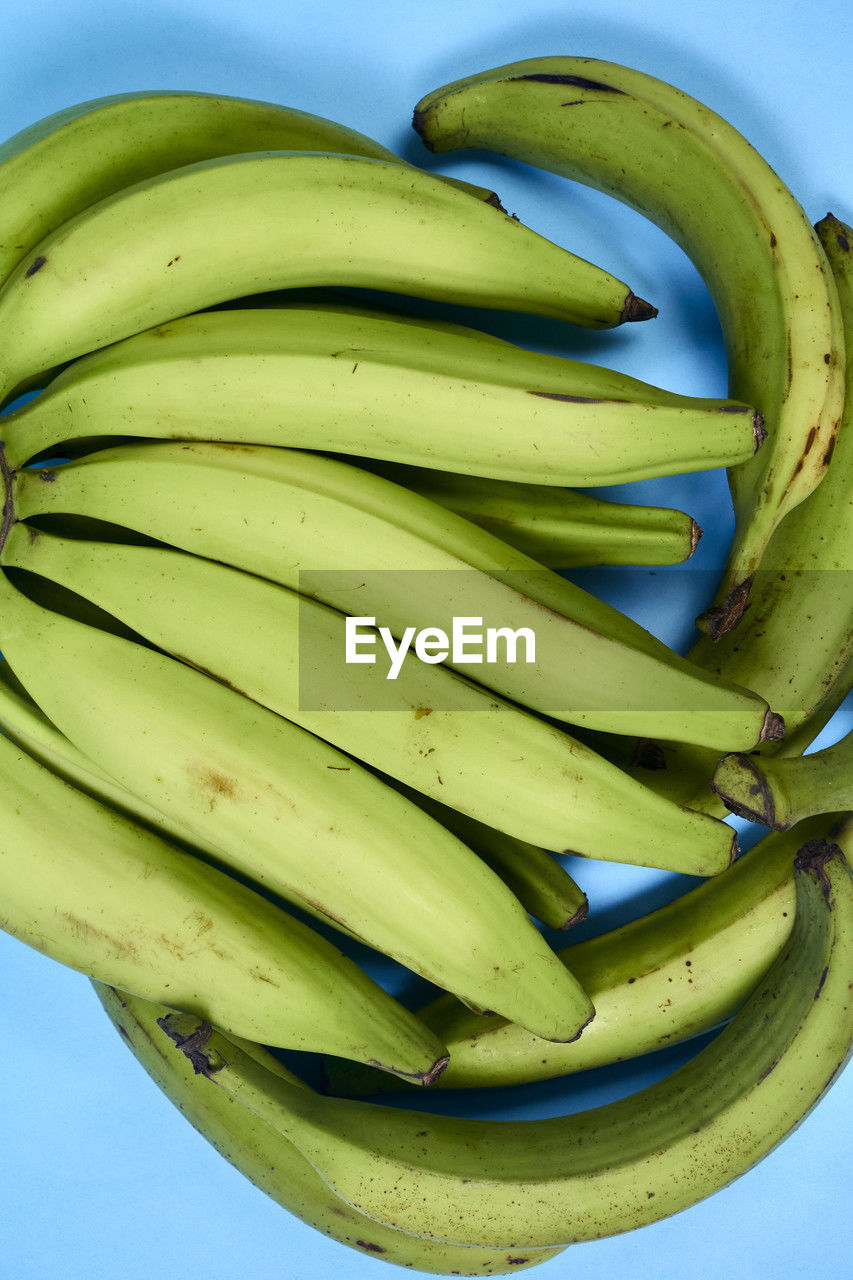 banana, healthy eating, food, food and drink, cooking plantain, produce, wellbeing, fruit, freshness, plant, green, blue, vegetable, no people, studio shot, yellow, nature, close-up, group of objects, bunch, ripe, organic, still life