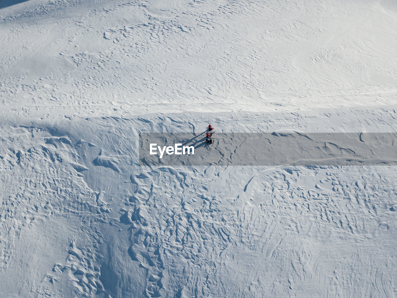 People skiing on snow covered field