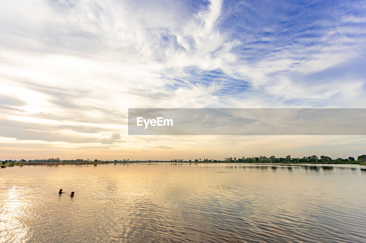 PANORAMIC VIEW OF SEA AGAINST SKY DURING SUNSET