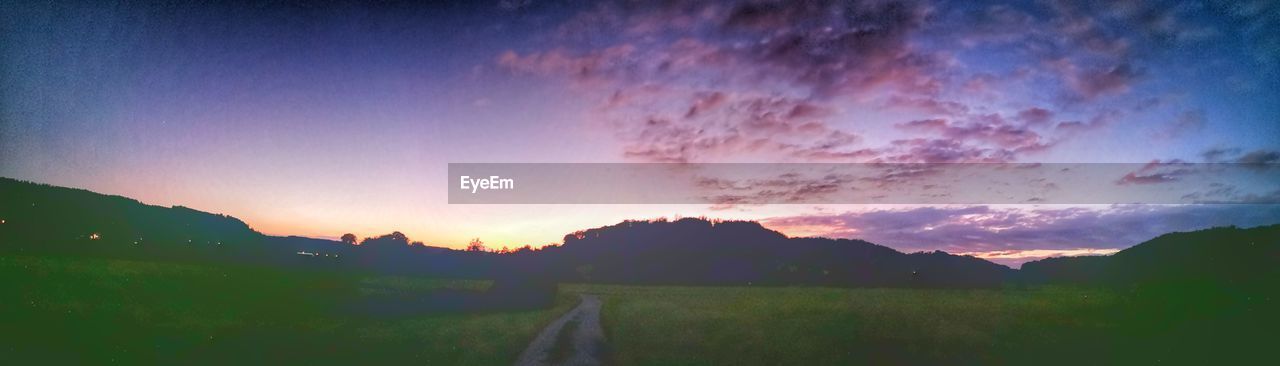 PANORAMIC VIEW OF SILHOUETTE LANDSCAPE DURING SUNSET