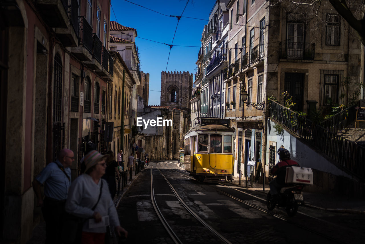 VIEW OF VEHICLES ON STREET IN CITY