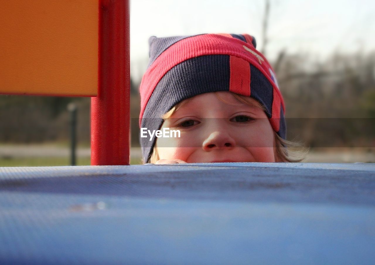 Portrait of boy playing at playground