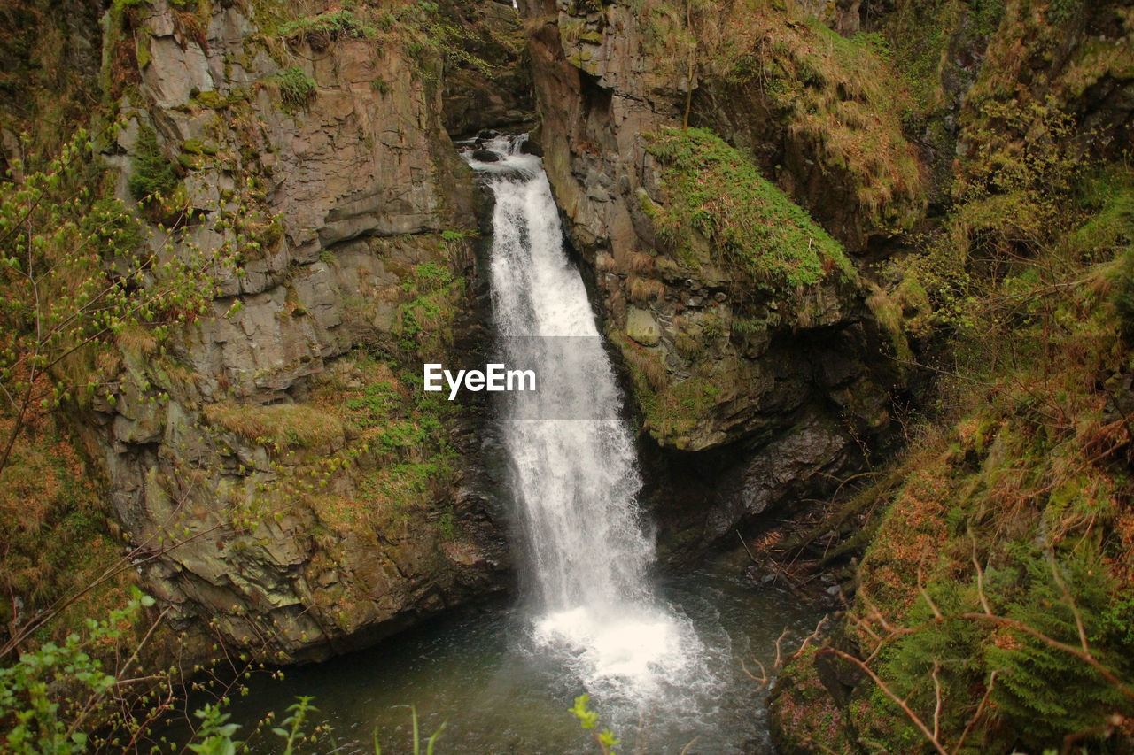 SCENIC VIEW OF WATERFALL