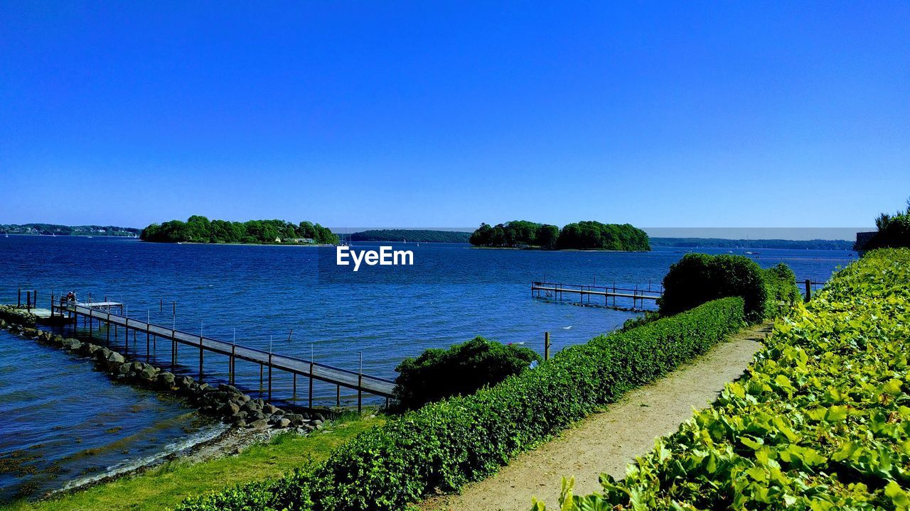 SCENIC VIEW OF BLUE SEA AGAINST CLEAR SKY