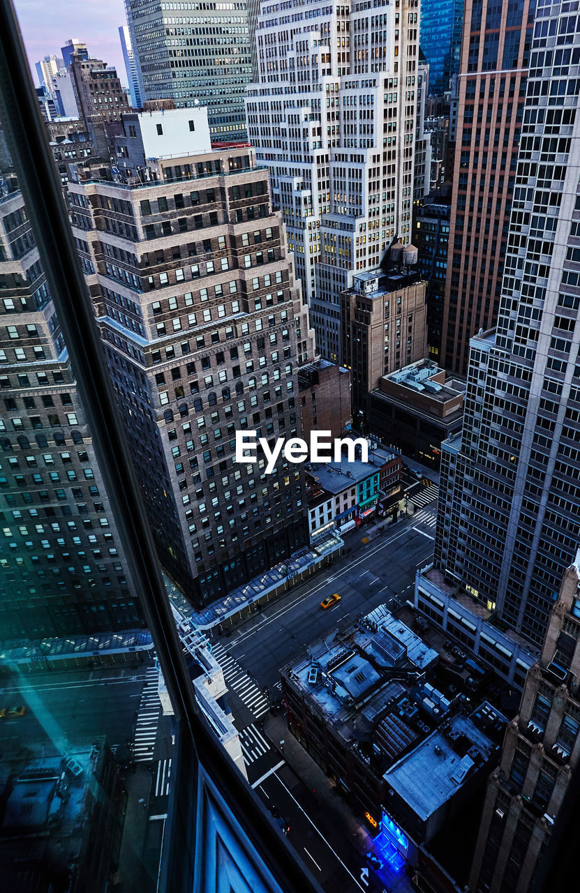 High angle view of street amidst buildings in city of manhattan new york