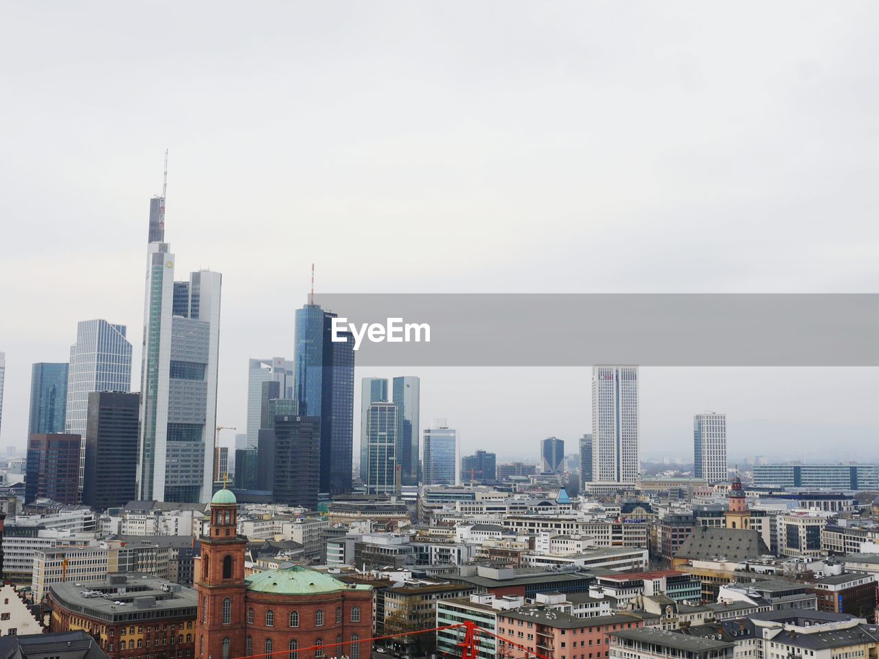 Buildings in city against sky