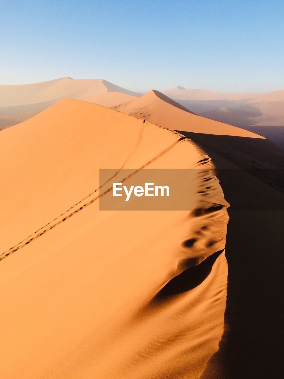 Scenic view of desert against sky