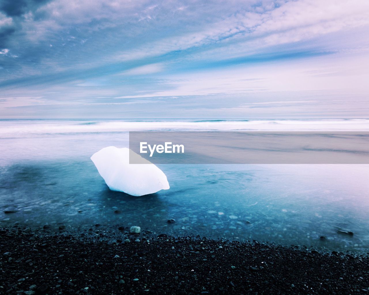 Scenic view of sea against sky during winter