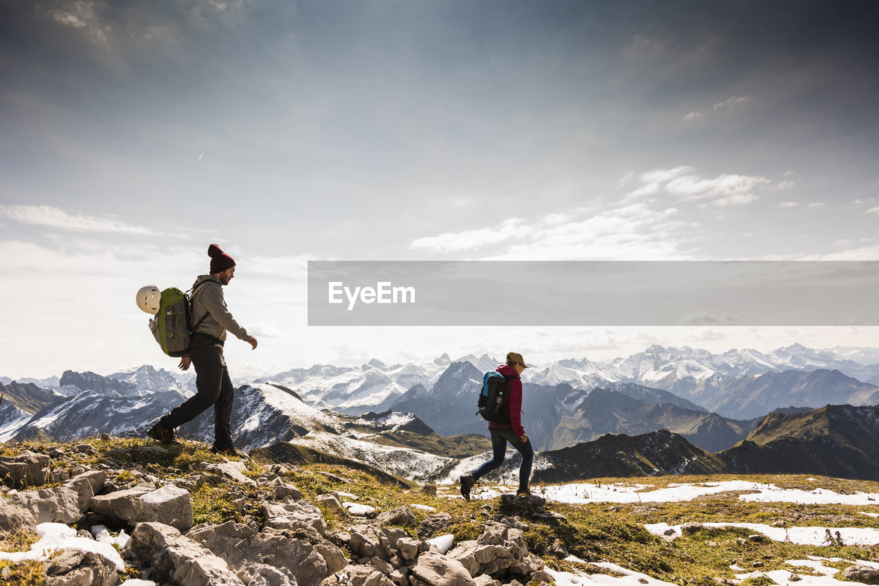 Germany, bavaria, oberstdorf, two hikers walking in alpine scenery