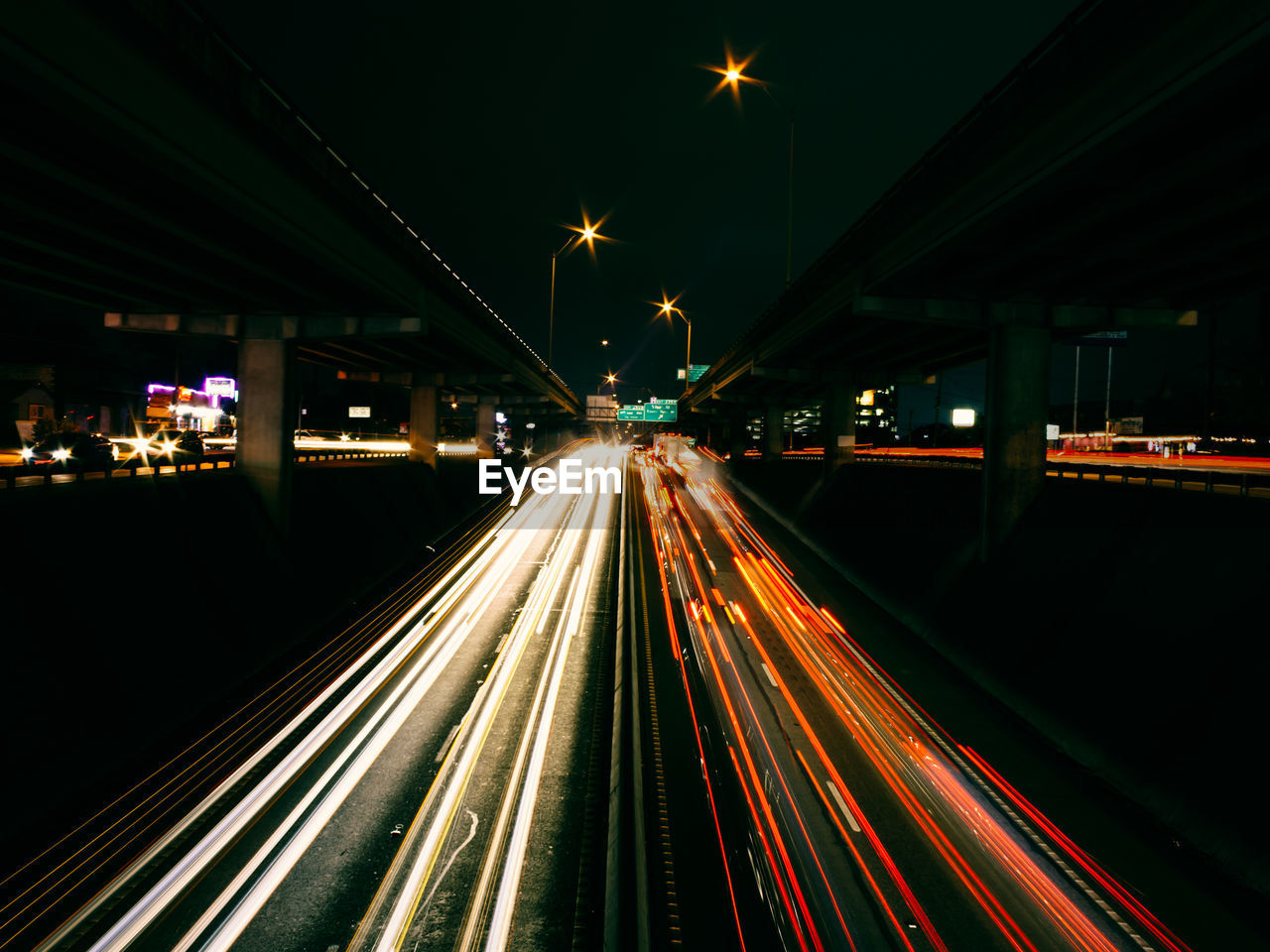 Light trails on road in city at night