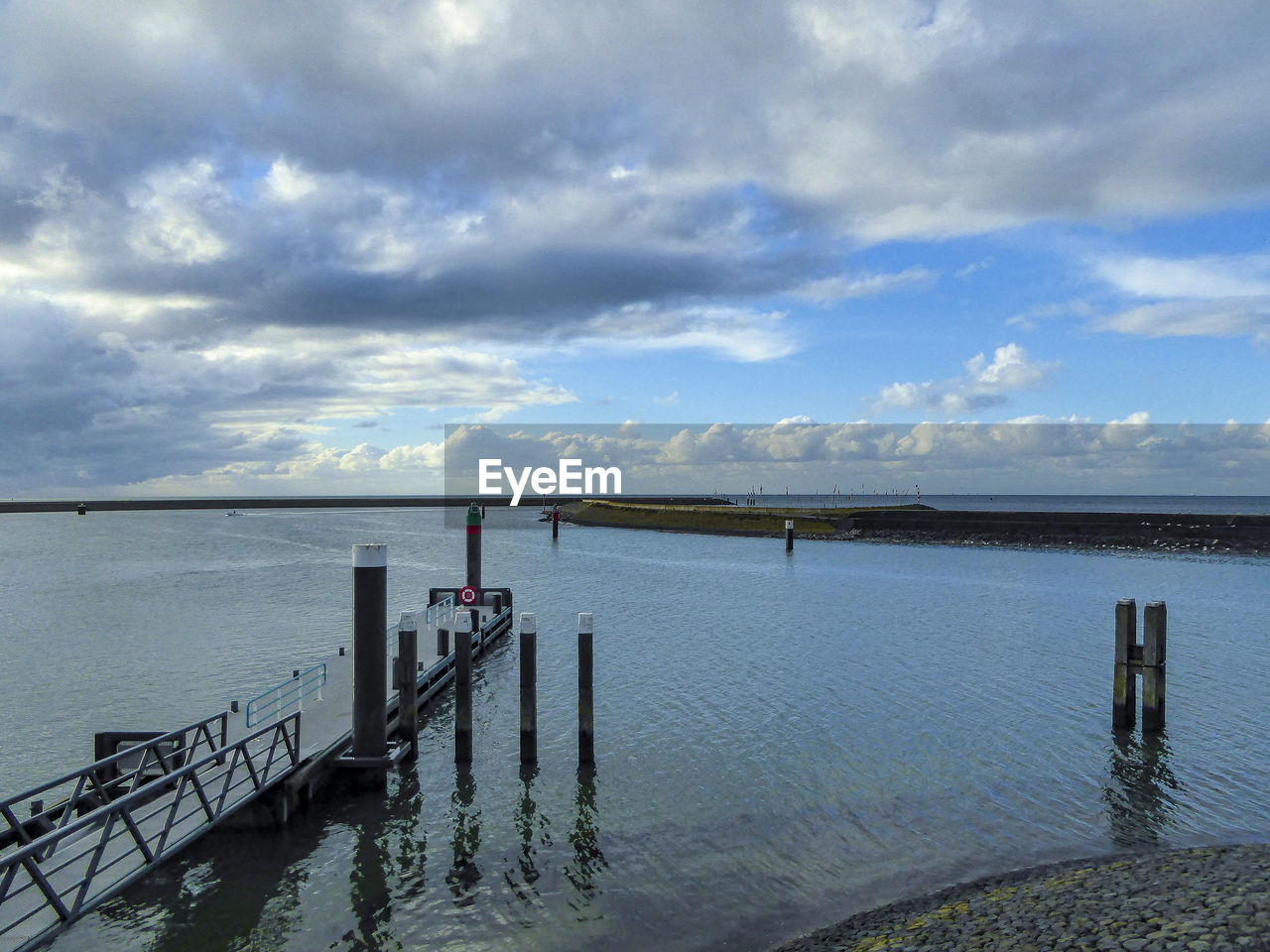 Pier over sea against sky