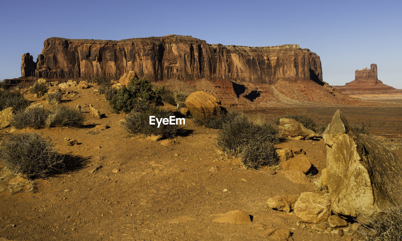 Rock formations in desert against clear sky