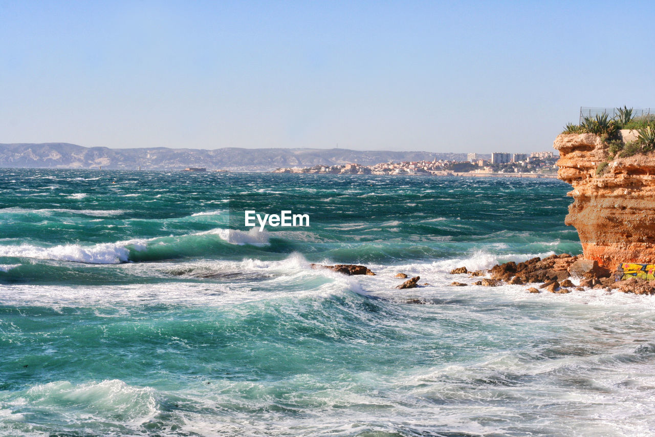 Scenic view of sea against clear sky
