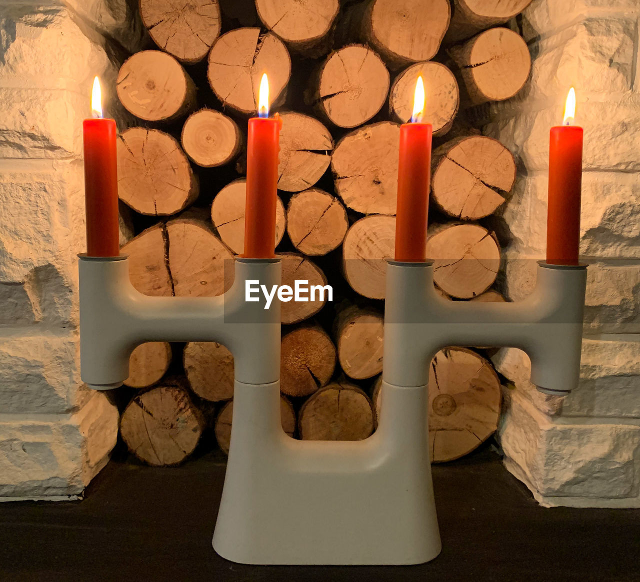 candle, flame, burning, fire, lighting, indoors, illuminated, no people, heat, large group of objects, nature, candle holder, religion, table, glowing, celebration, high angle view, still life, wood, spirituality