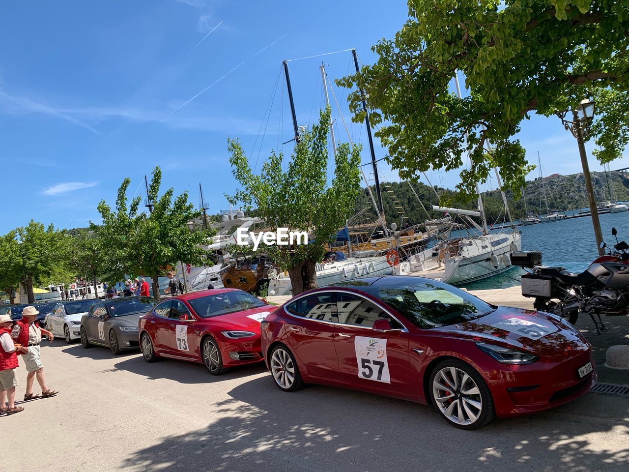 CARS ON ROAD AGAINST SKY