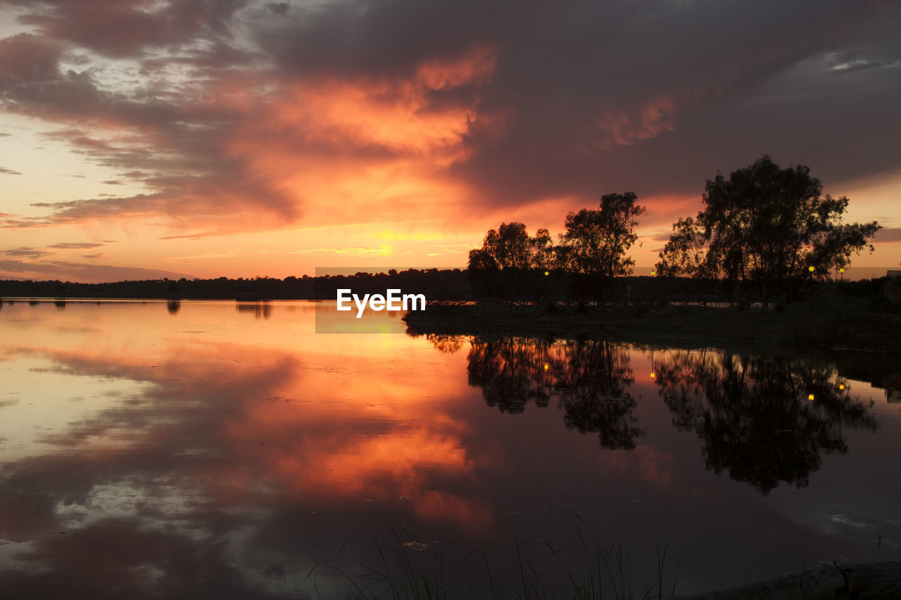 Scenic view of lake against sky during sunset