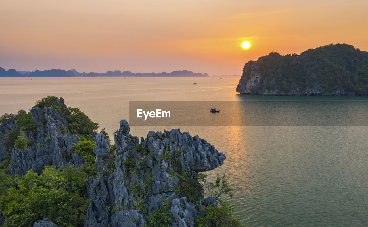 Scenic view of sea against sky during sunset