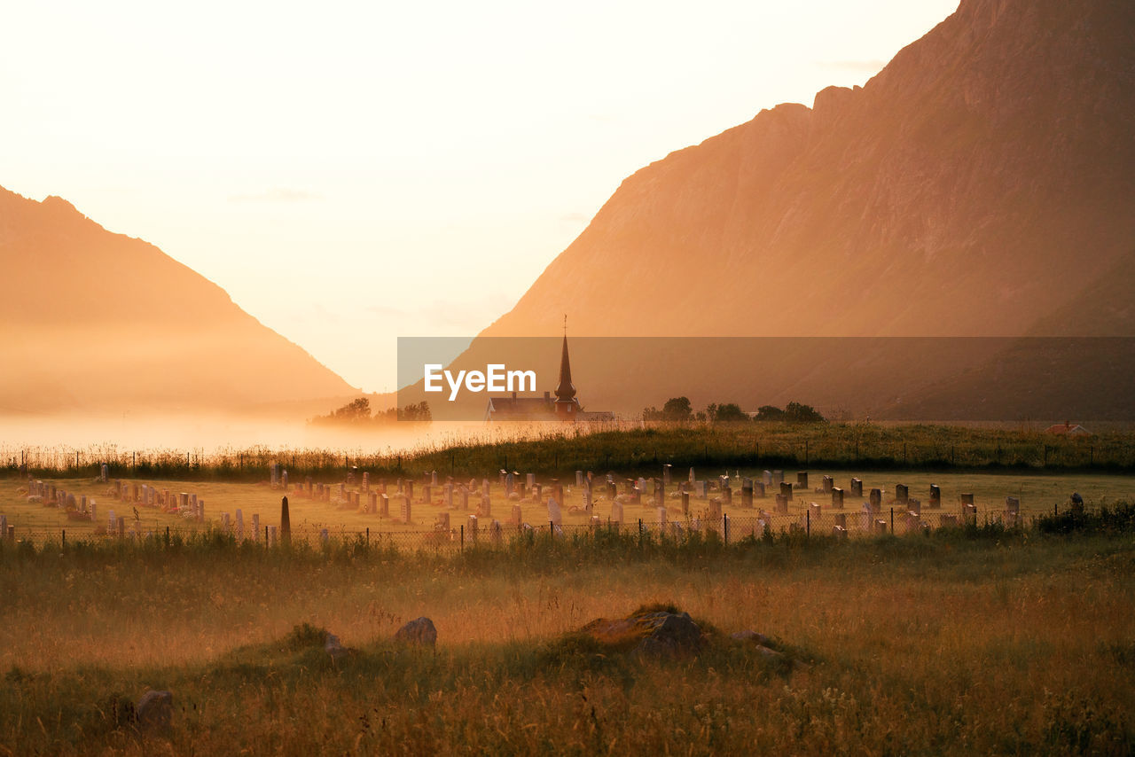 SCENIC VIEW OF LANDSCAPE AGAINST SKY DURING SUNSET