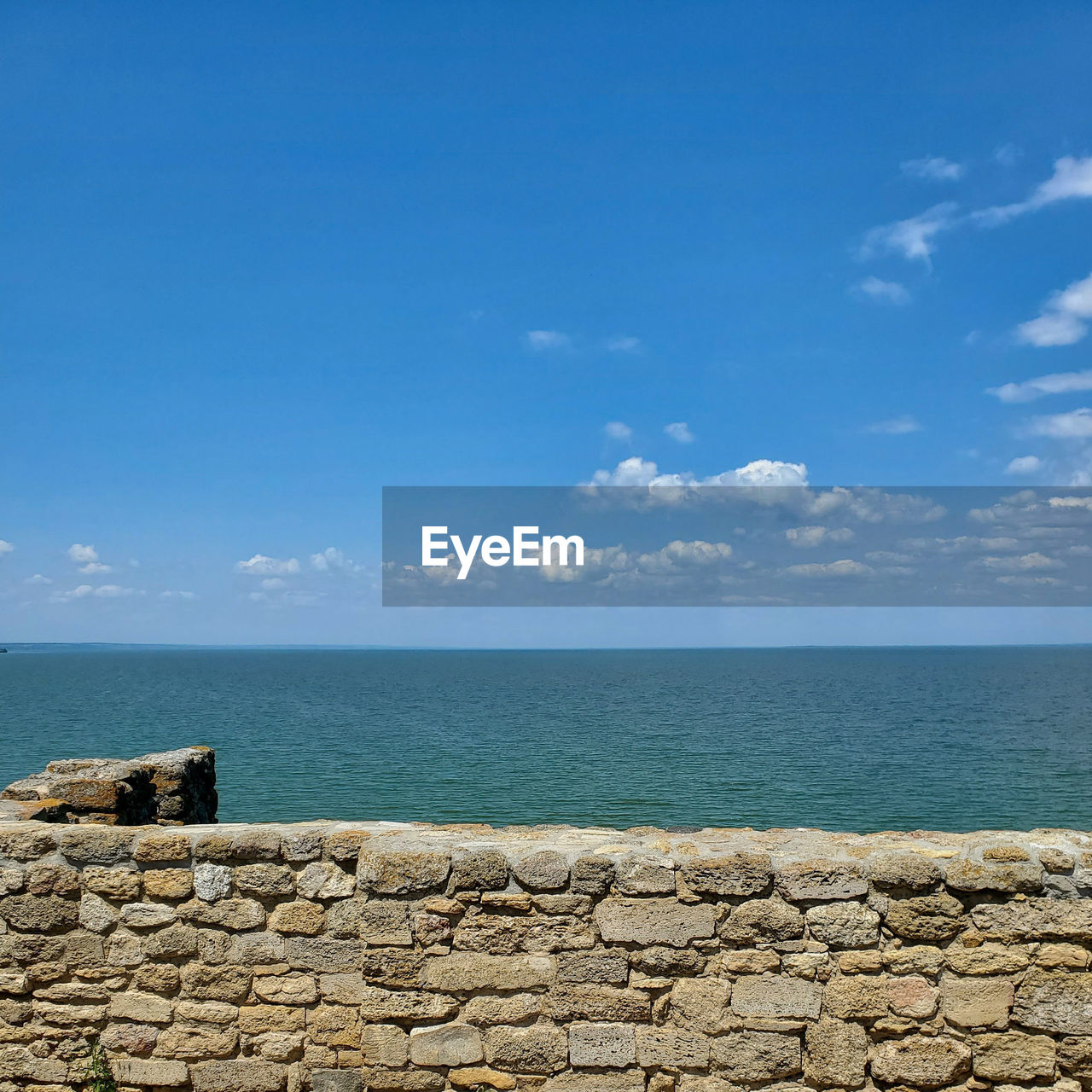 View of the sea and sky from the old stone wall of the fortress