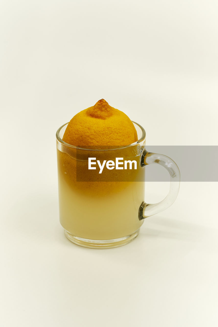 Close-up of tea cup against white background