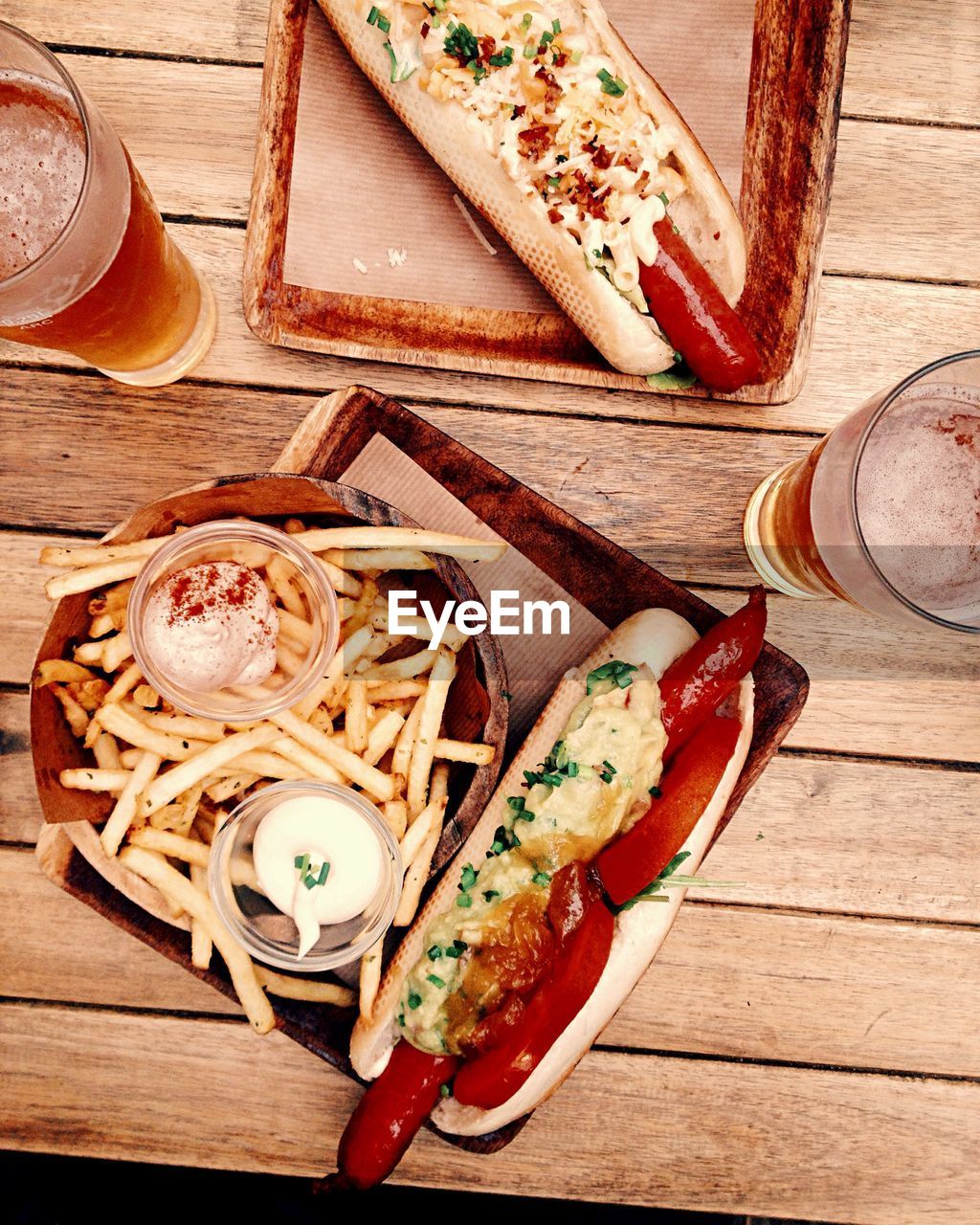 Directly above shot of hot dogs and drinks on table