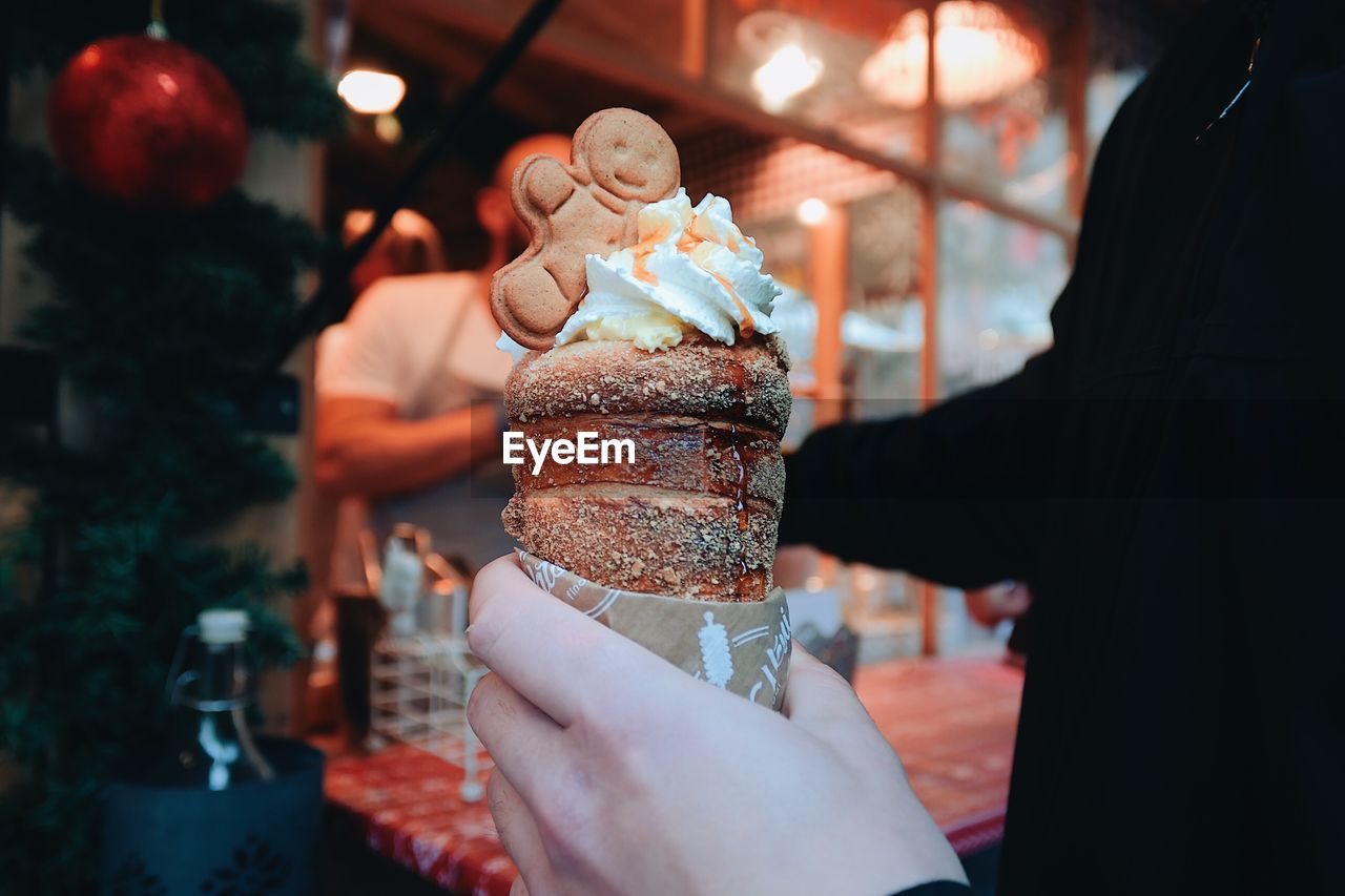 Person holding ice cream cone