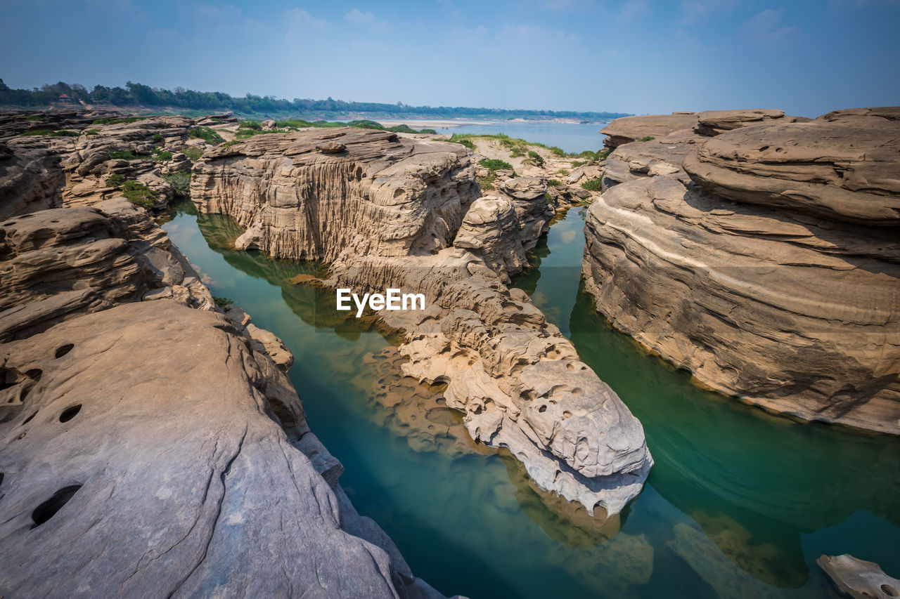 Panoramic view of rock formations against sky