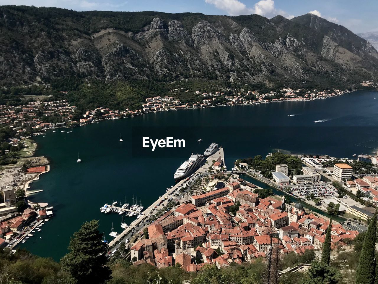 High angle view of lake and buildings in city