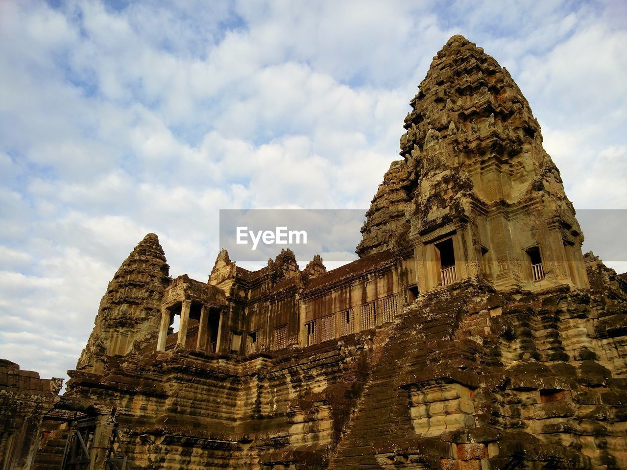 Low angle view of old temple against sky