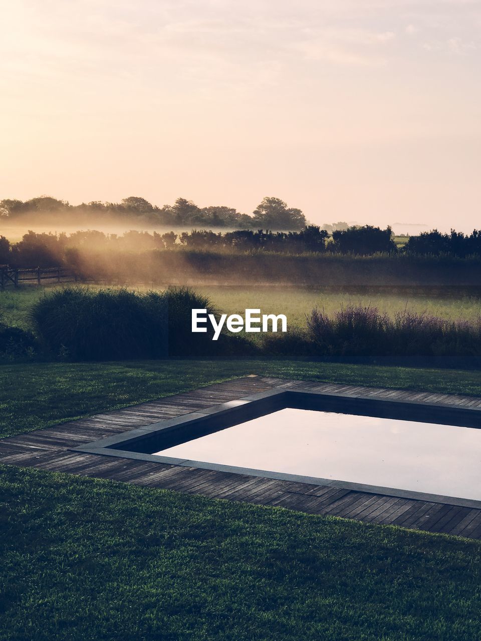 Scenic view of field against sky during sunset