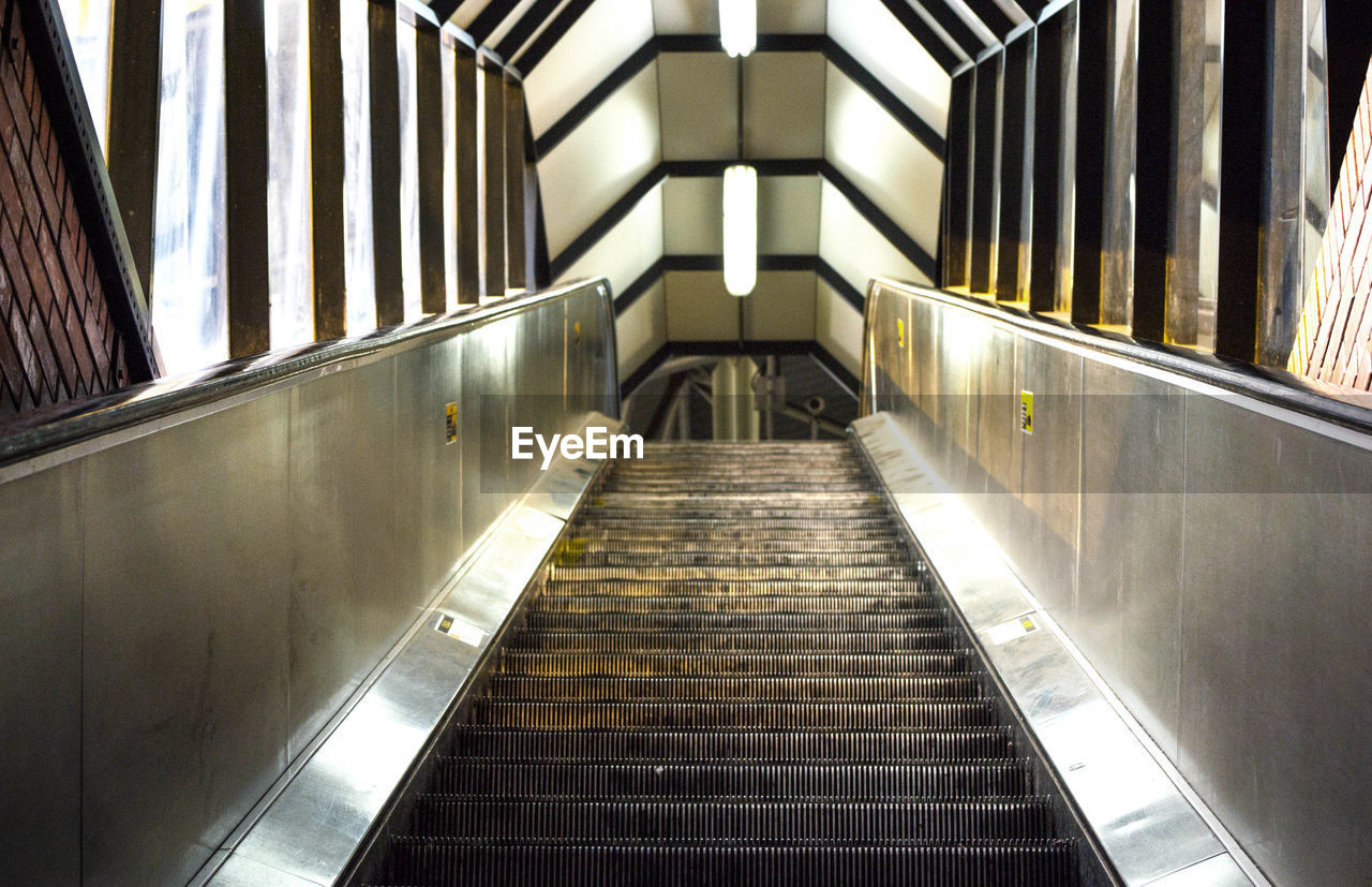 Low angle view of empty escalator at subway station