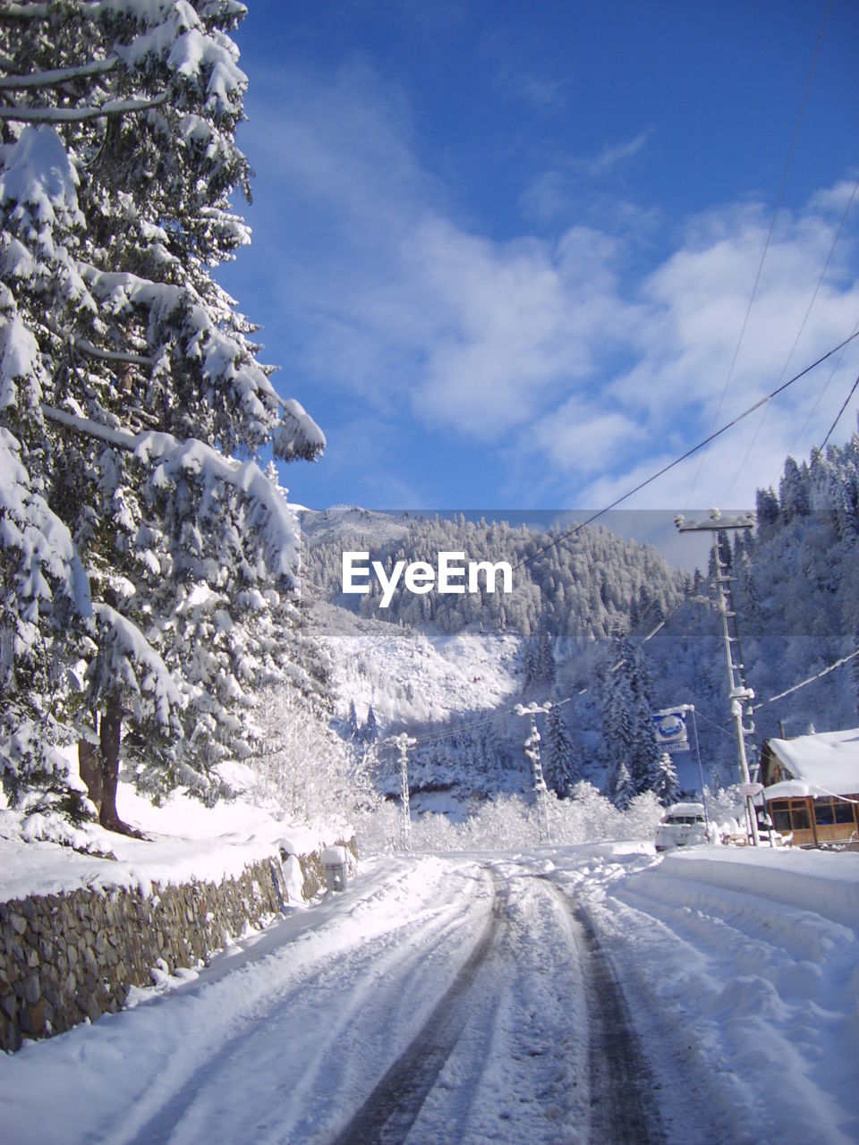 Snow covered landscape against sky