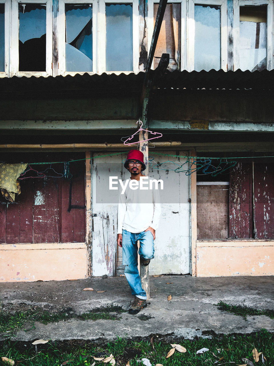 Full length of man standing outside building