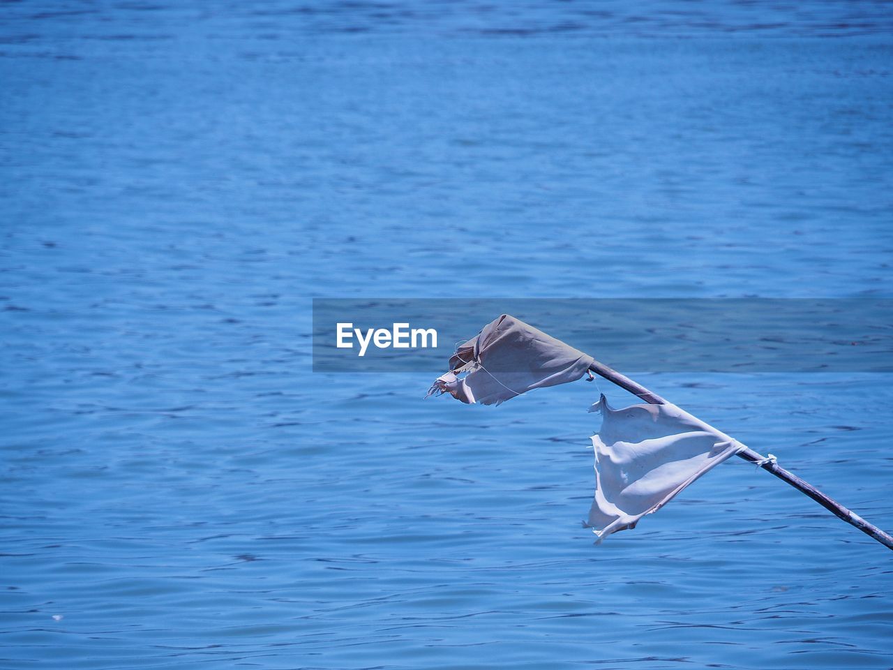 The banner was blown by the wind, by the river.