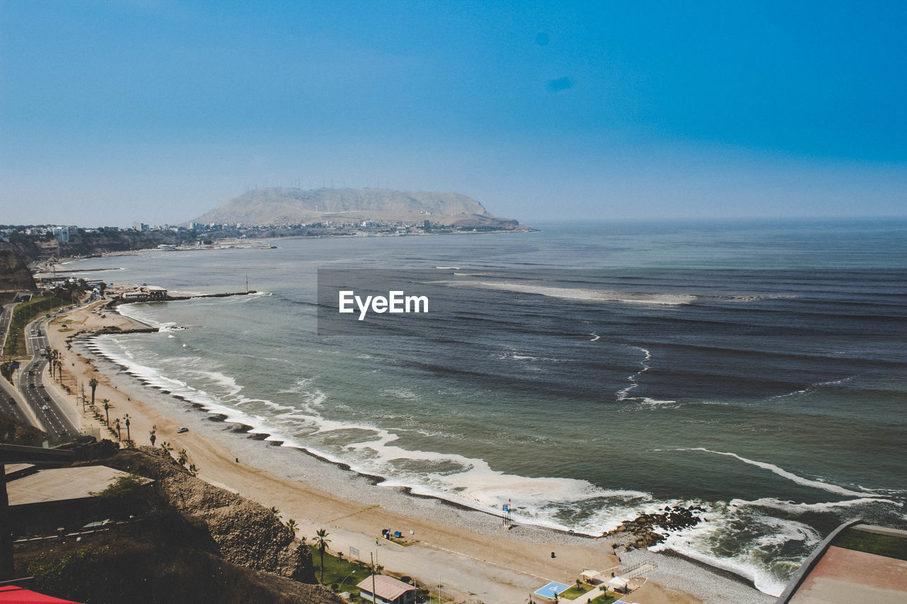 Scenic view of beach against clear sky