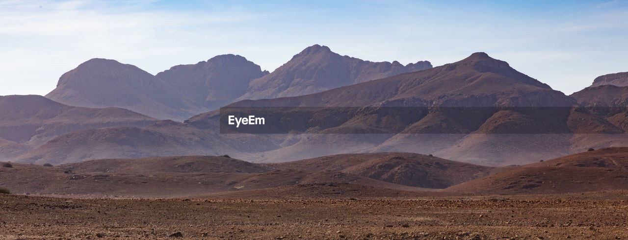 Scenic view of rocky mountains against sky