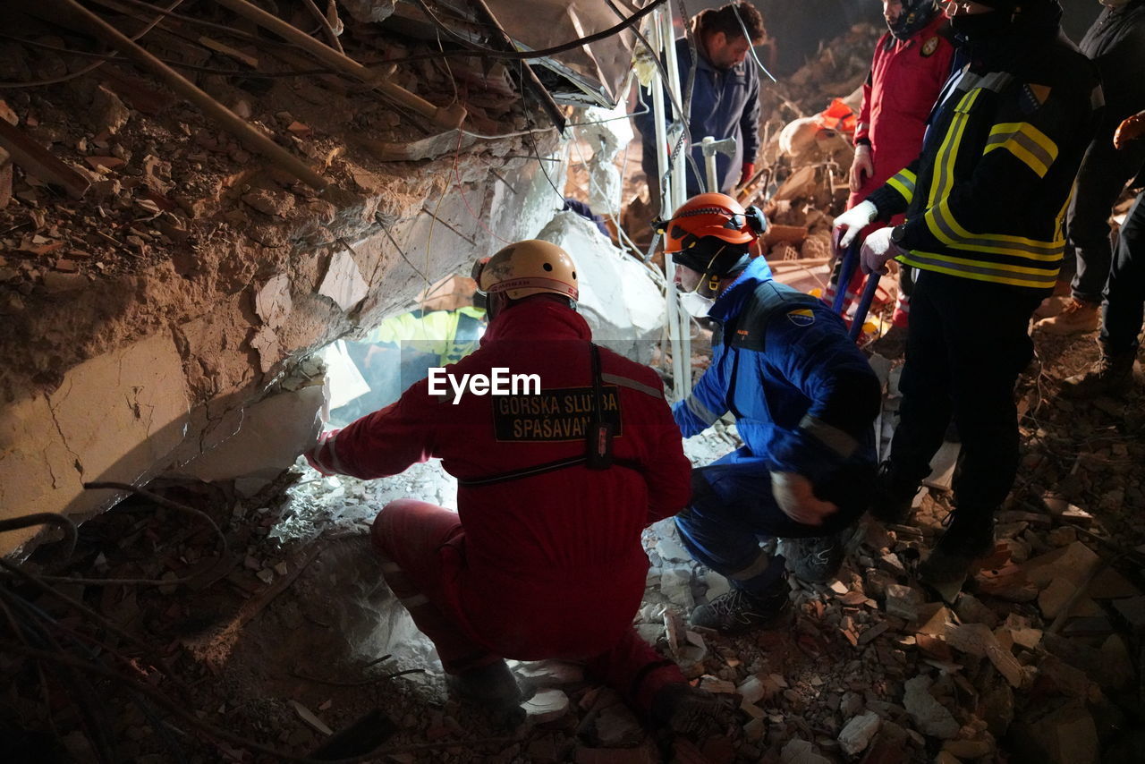 cave, group of people, adult, men, caving, accidents and disasters, occupation, clothing, nature, cooperation, healthcare and medicine, person, teamwork