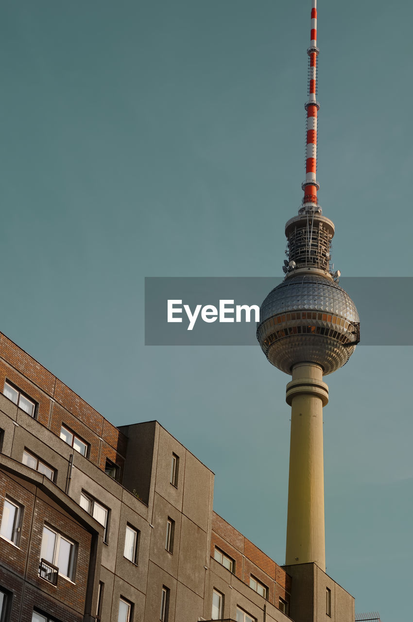 Low angle view of fernsehturm against clear sky