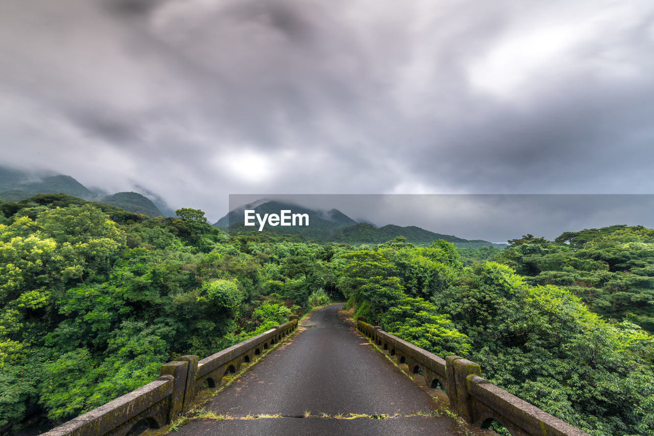 Scenic view of green mountains against sky