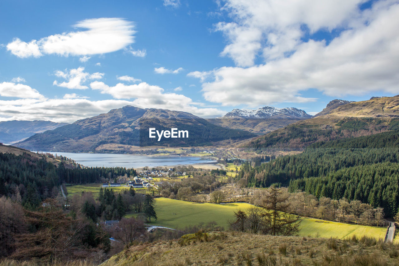 Scenic view of mountains against cloudy sky