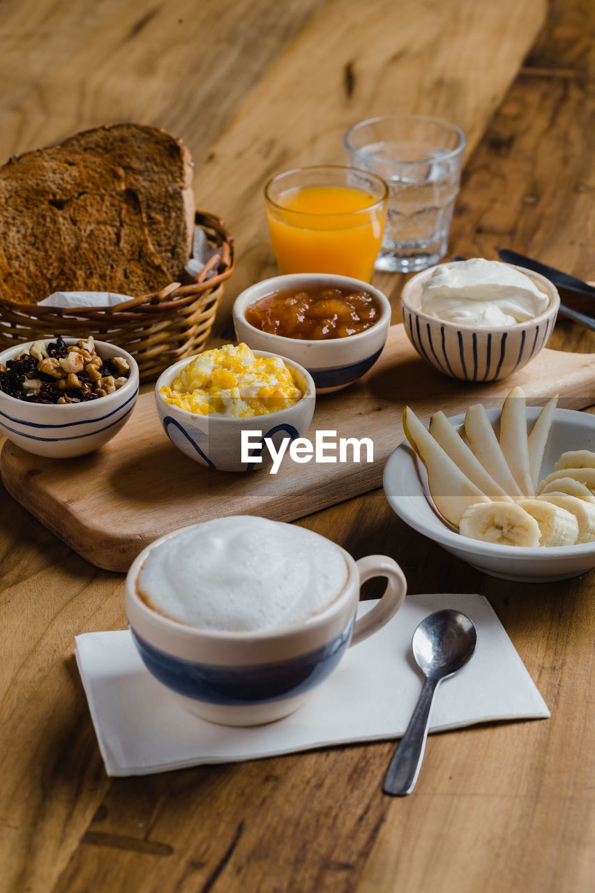 HIGH ANGLE VIEW OF BREAKFAST AND TABLE