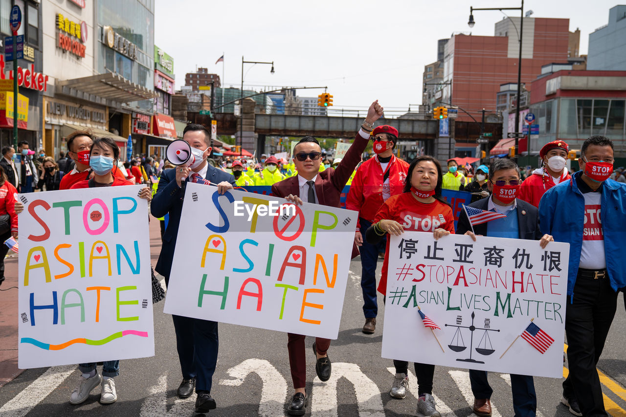 GROUP OF PEOPLE IN FRONT OF BUILDING