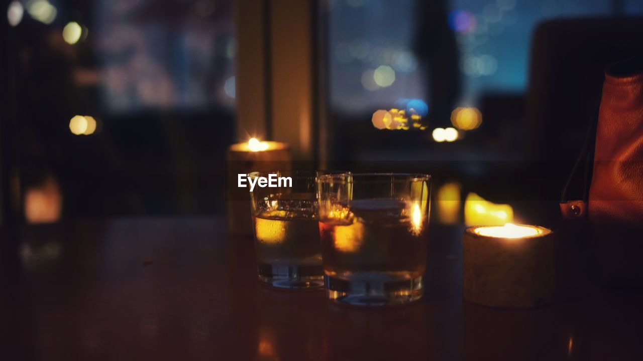 Close-up of tea light candles on table