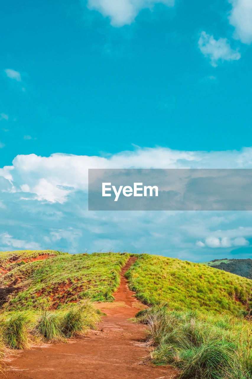 View of landscape against blue sky