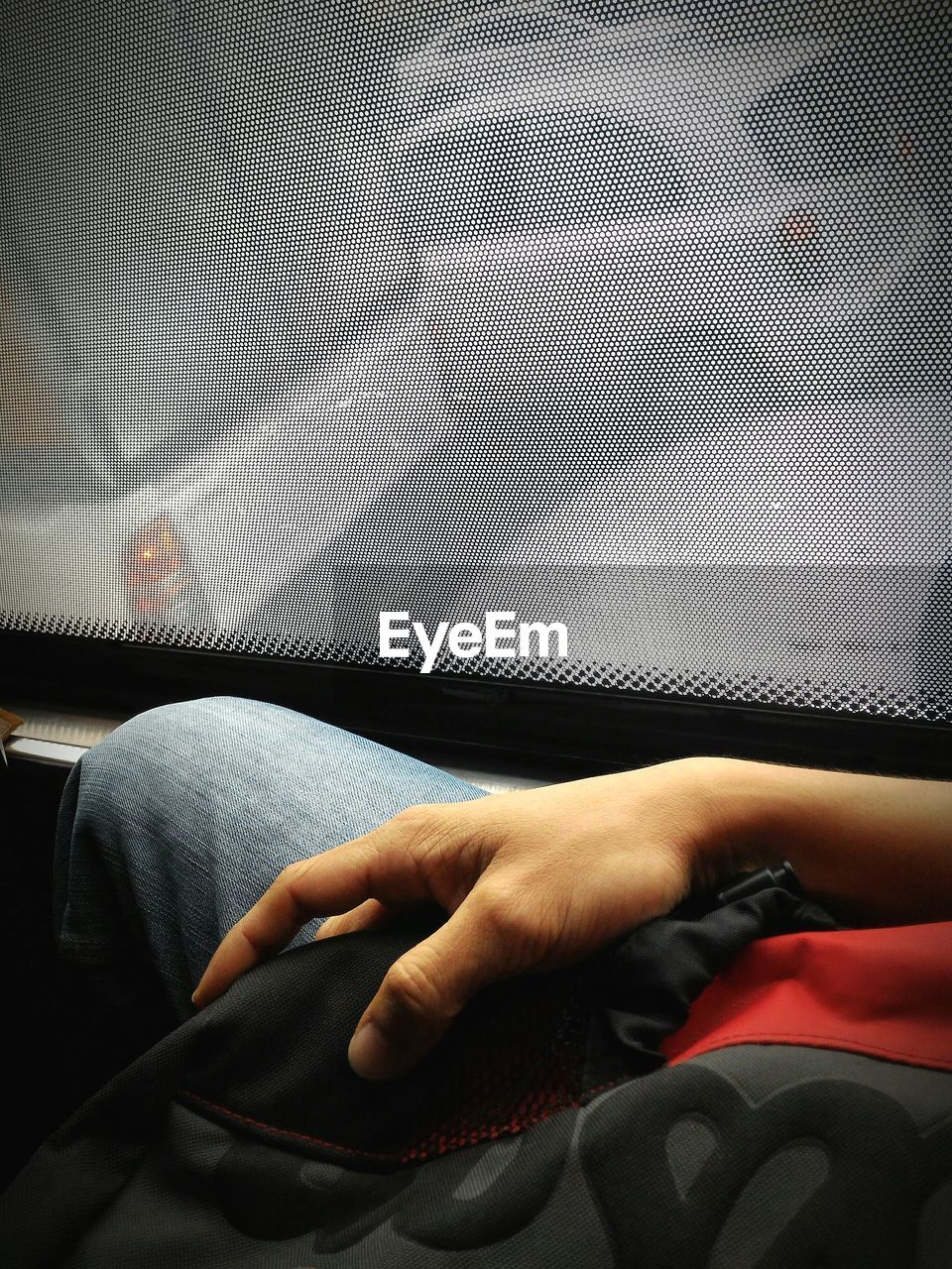Midsection of man sitting in bus