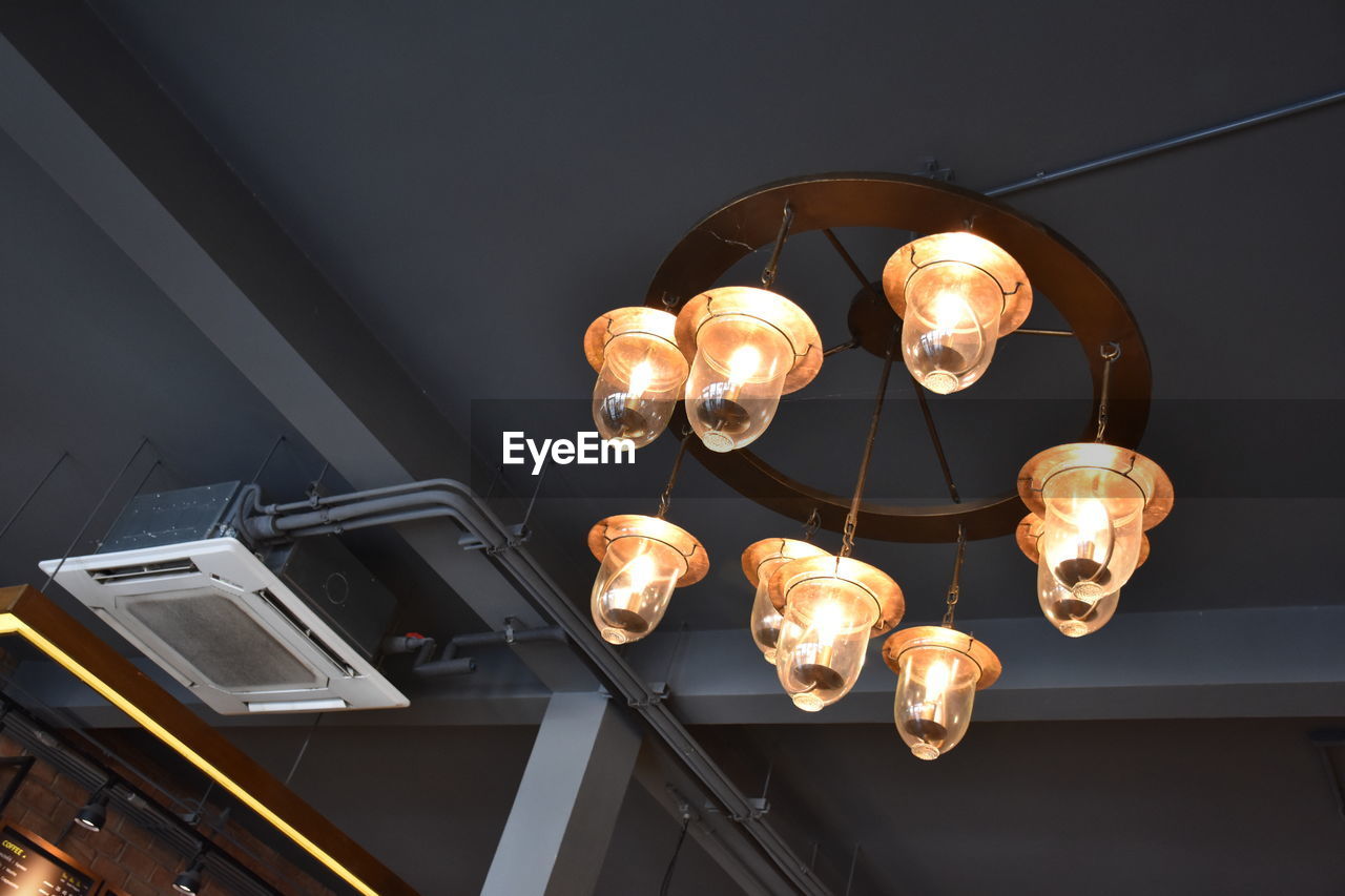 Low angle view of chandelier hanging on ceiling