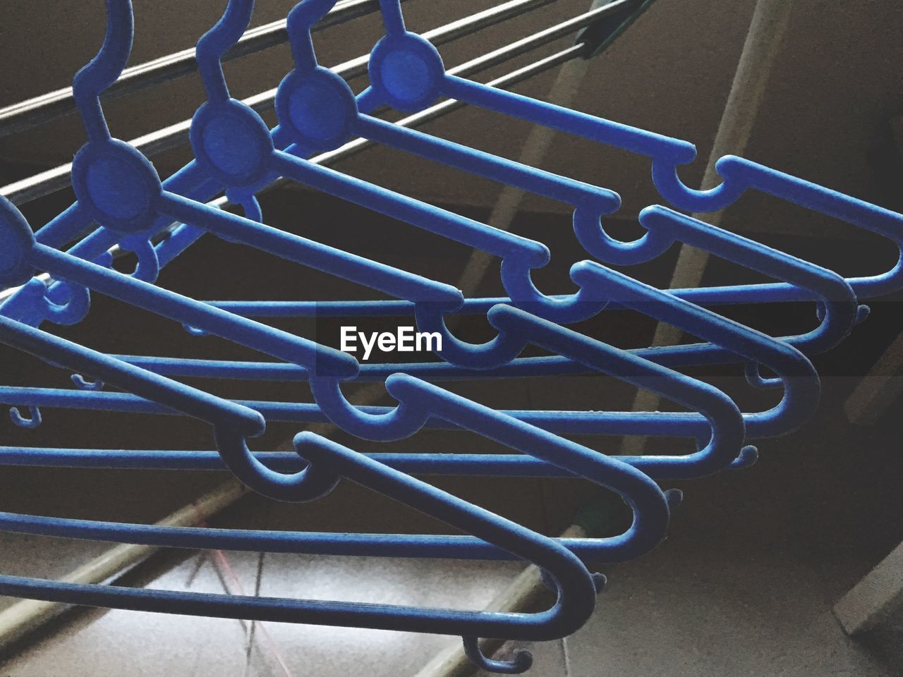 High angle view of coathangers hanging on rack