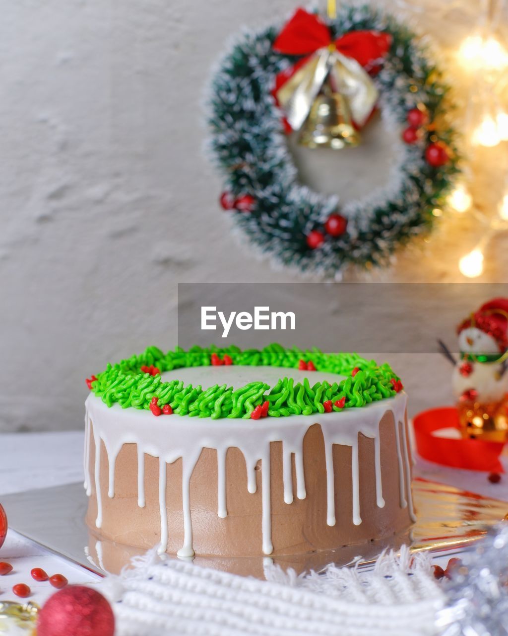 Close-up of cake with christmas decorations on table