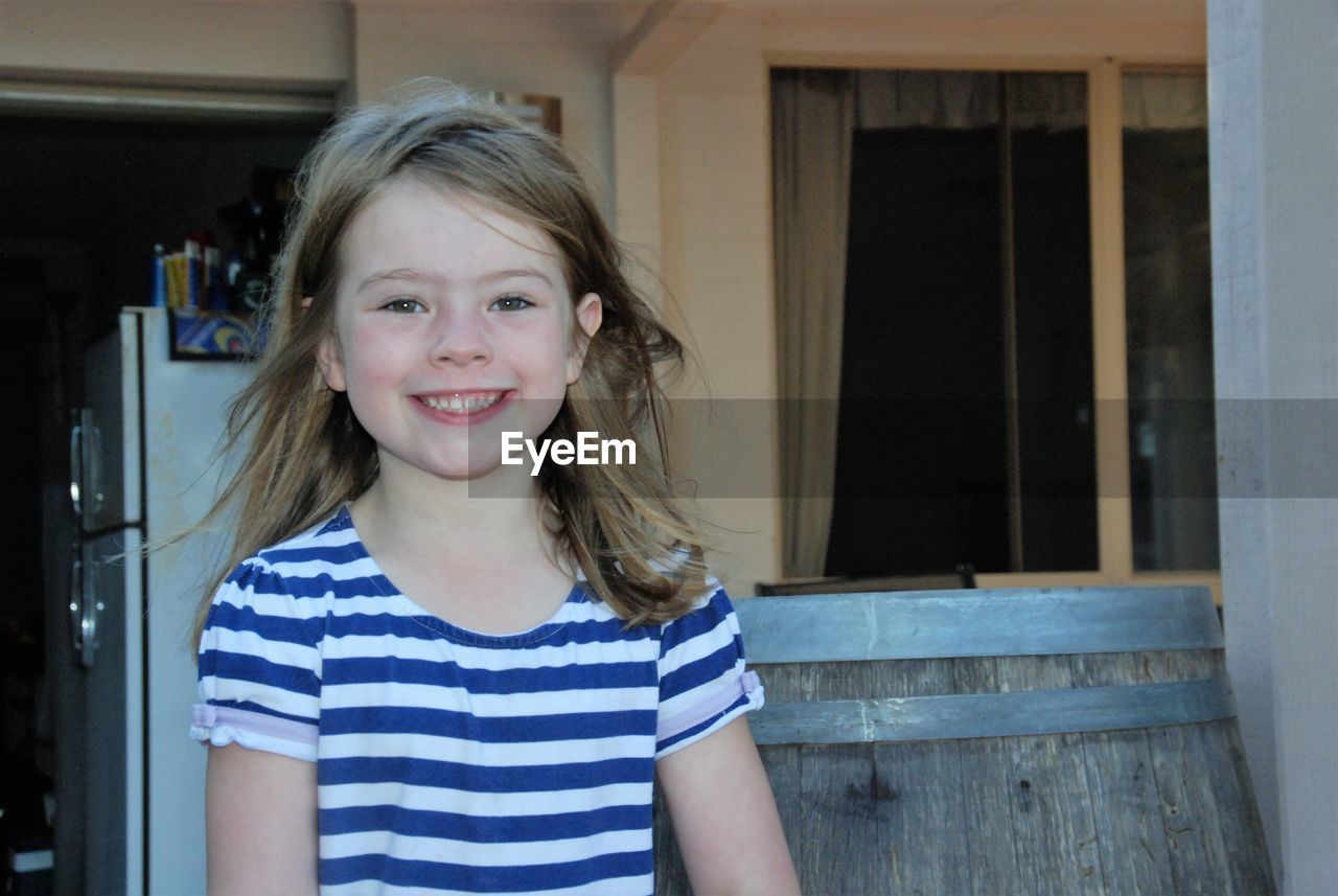 Portrait of smiling girl at home