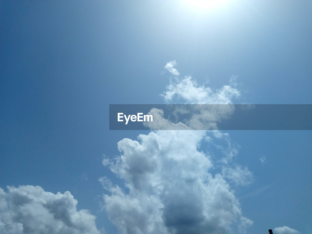 LOW ANGLE VIEW OF BLUE SKY ON SUNNY DAY